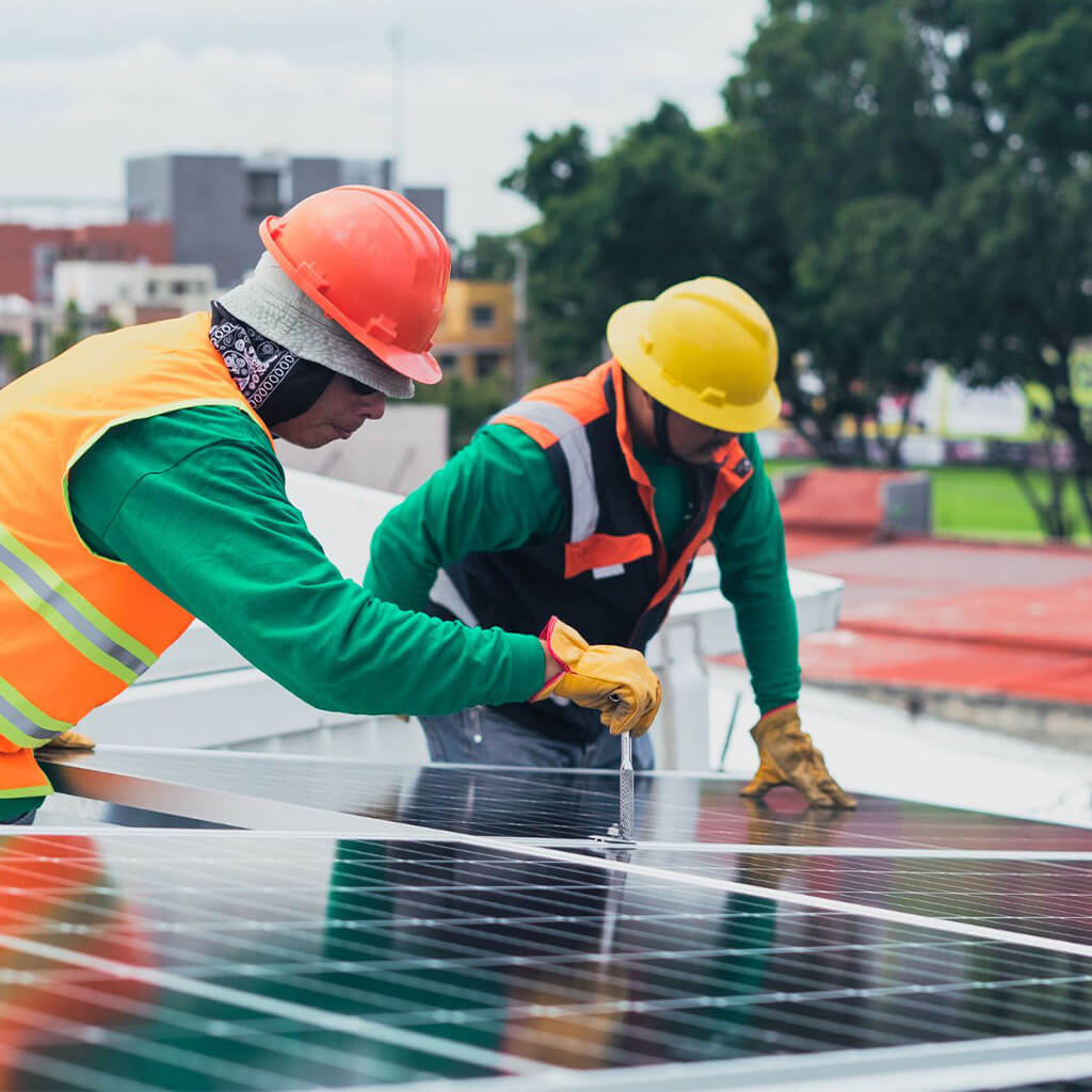 technicians installing solar panels