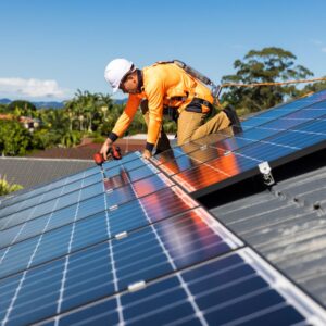 Solar Panel technician resetting solar panels after roofing repair.